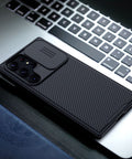 Protective Samsung Galaxy S23 Ultra case with sliding camera cover and drop protection.